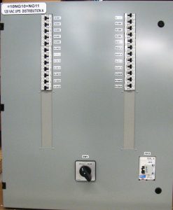 Compact panel with dual ac distribution bus with manual bypass switch and padlocked breaker.