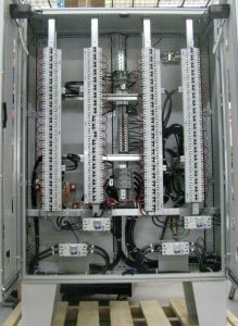 Compact panel with dual ac distribution bus with manual bypass switch and padlocked breaker.